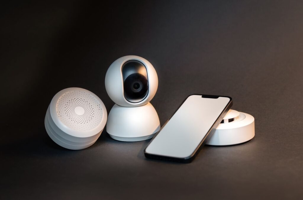 Mastering the First Impression: Your intriguing post title goes here A sleek smartphone with modern smart home devices on a minimalist gray background.